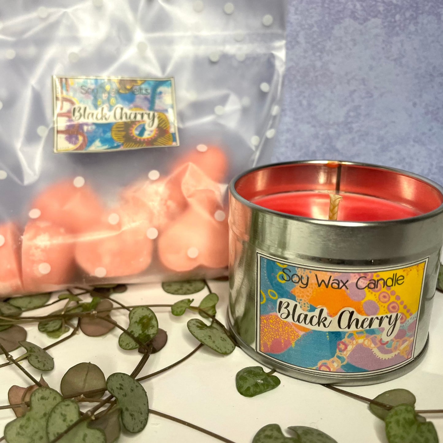 black cherry candle , silver tin candle and wax melts bag with sticker design